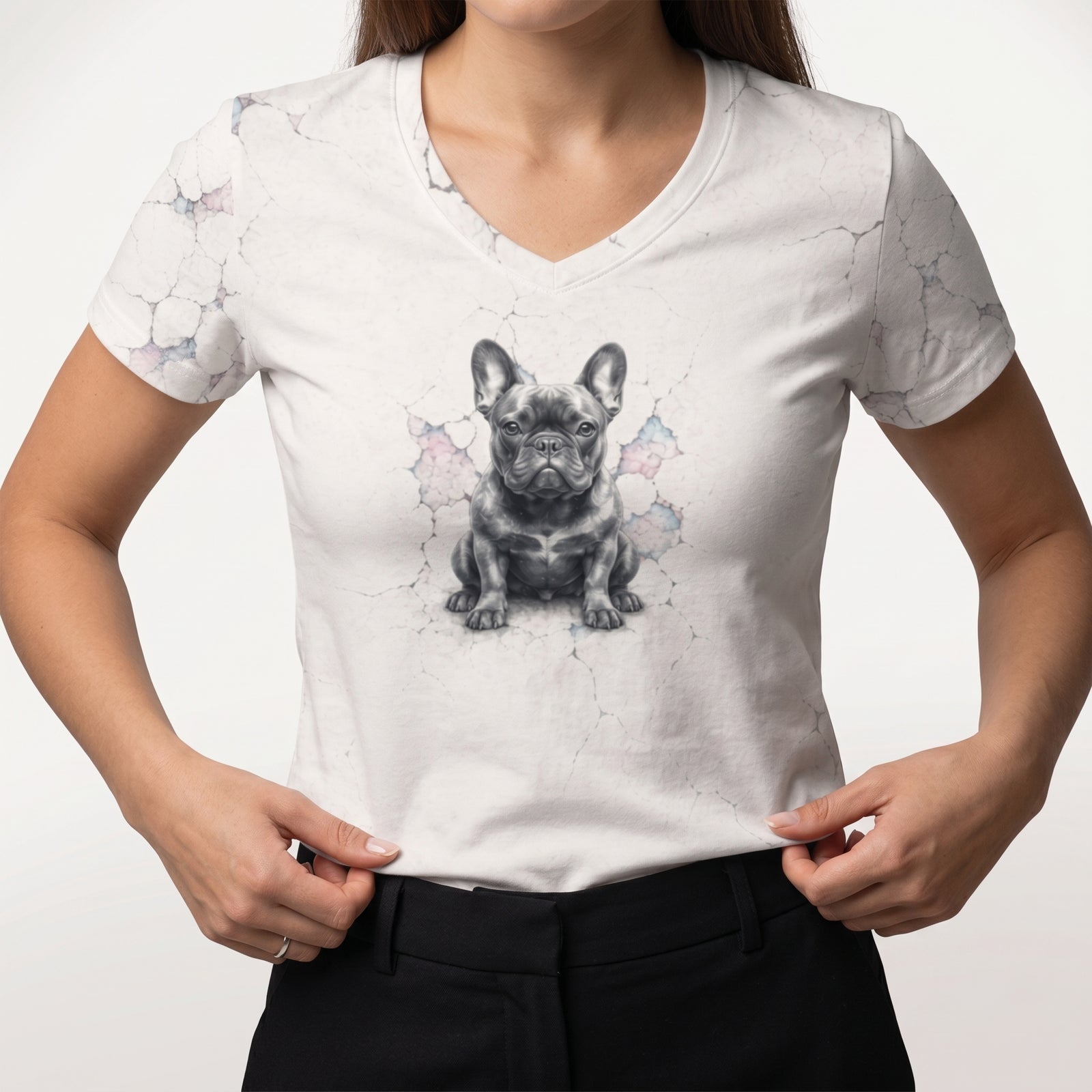White t-shirt with a dog graphic worn by a person on a plain background