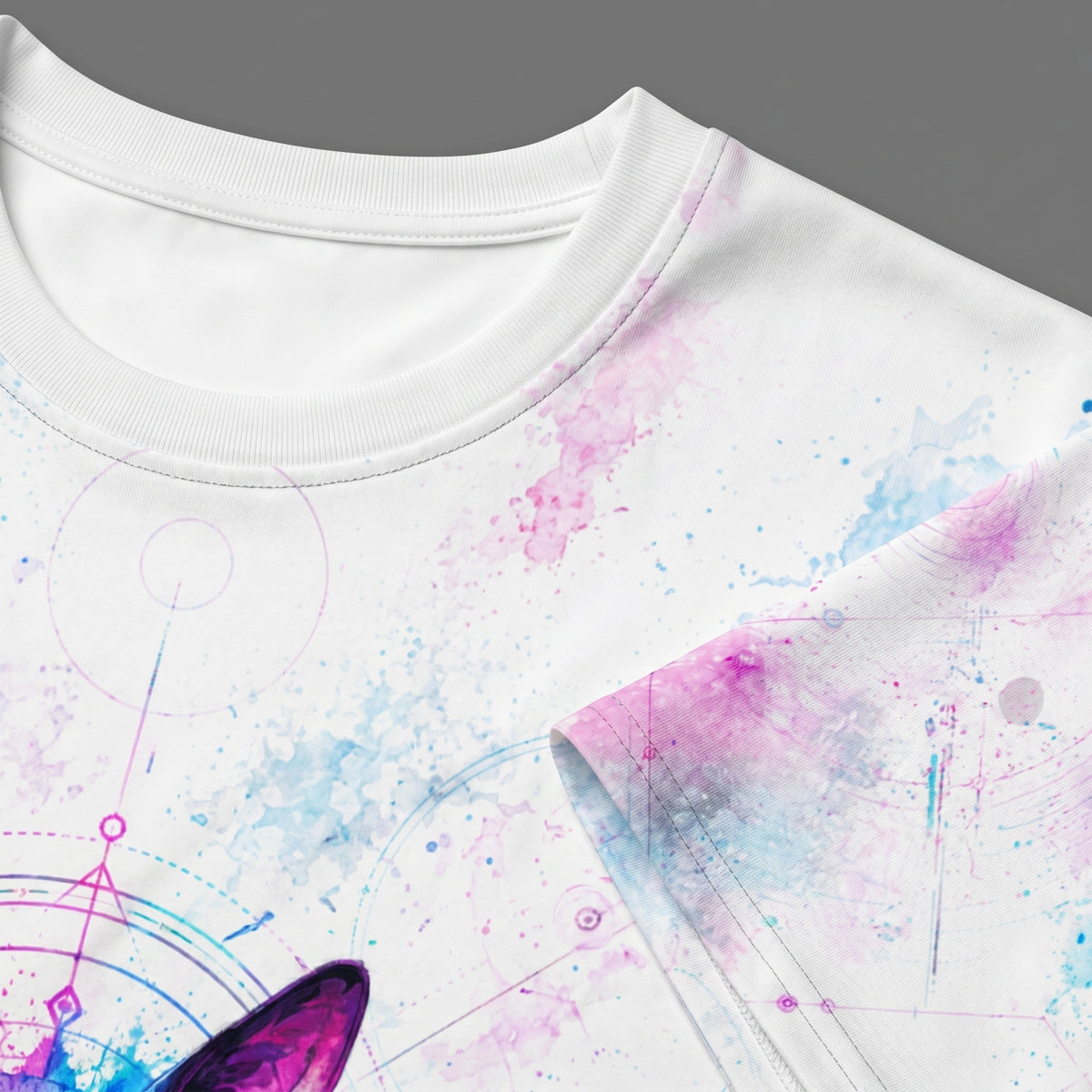 White t-shirt with colorful abstract design on a gray background