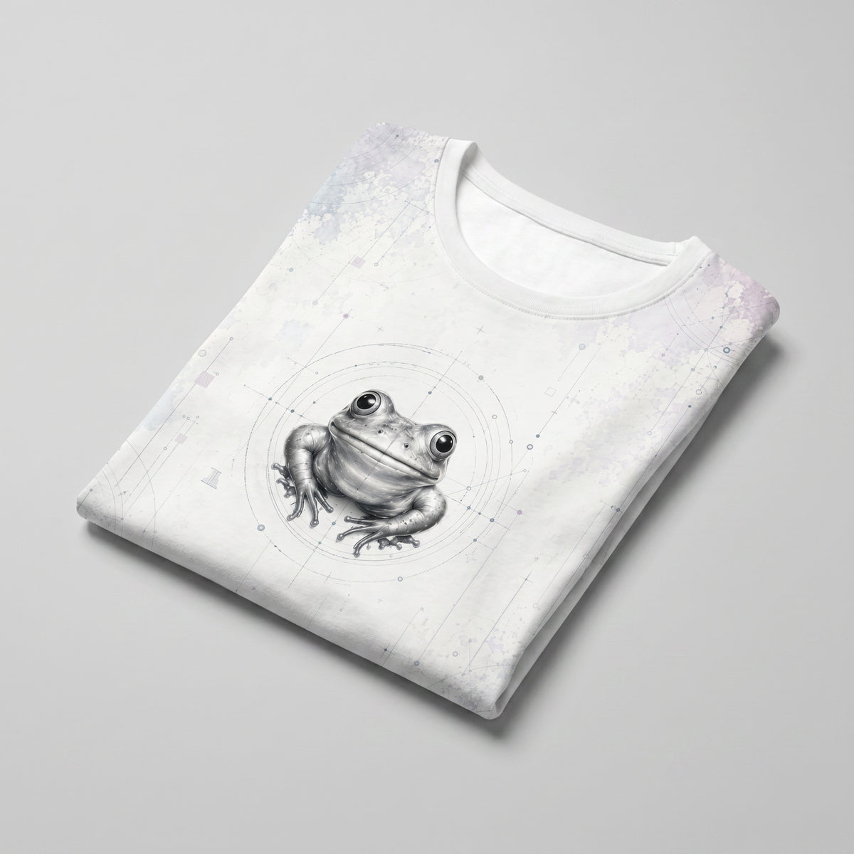 Folded white t-shirt with a frog graphic on a gray background