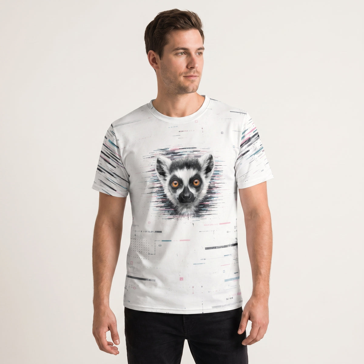 Man wearing a white t-shirt with a lemur graphic on a plain background