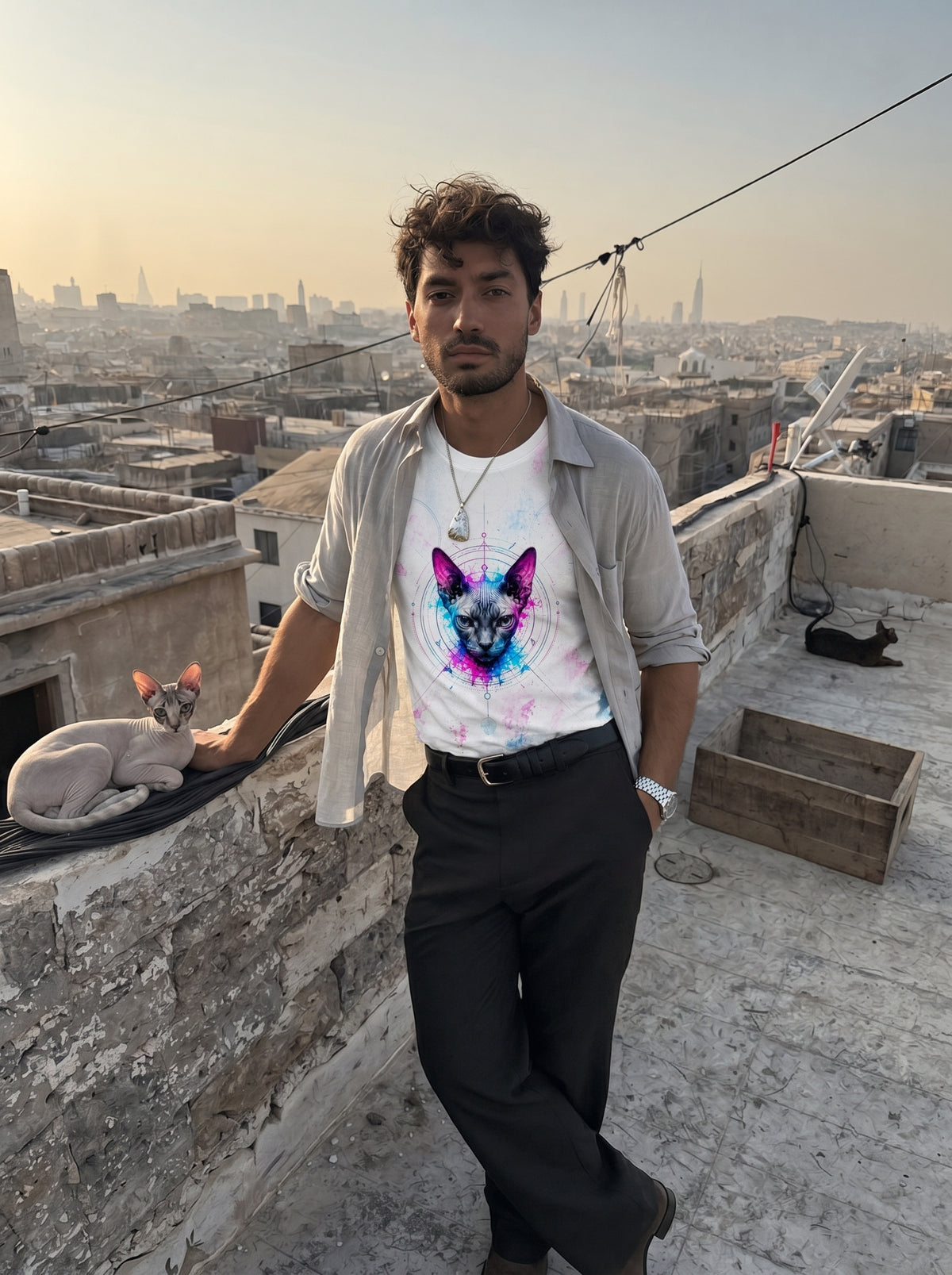 Person standing on a rooftop with a cityscape in the background wearing a Shynx Cat t-shirt