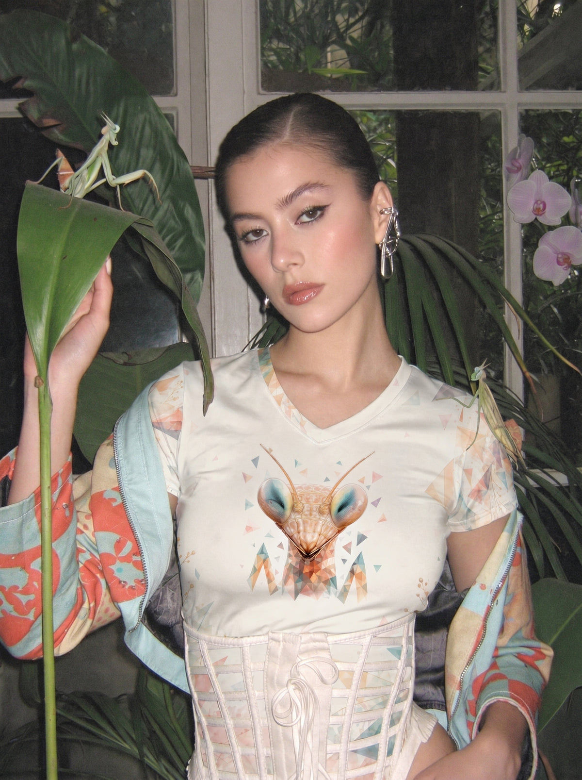 Model wearing the SilverWEAR mantis women’s T-shirt in an editorial portrait setting.