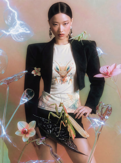 Editorial fashion image of a model wearing the SilverWEAR mantis women’s T-shirt with surreal floral styling.