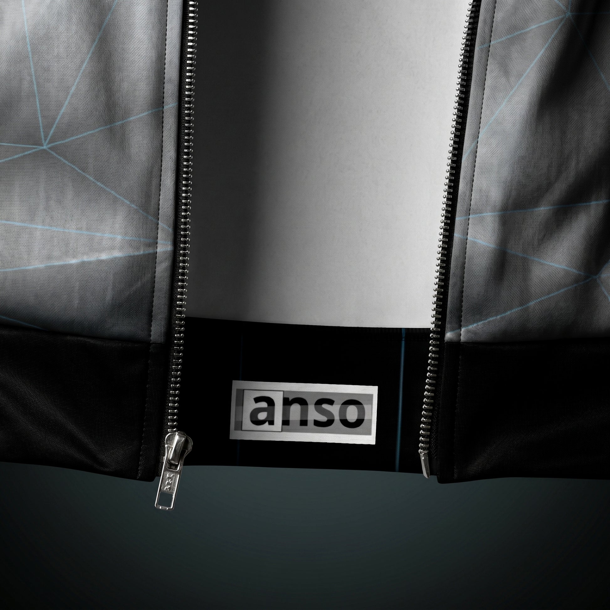 Close-up of a jacket with a zipper and 'anso' brand logo on a white background