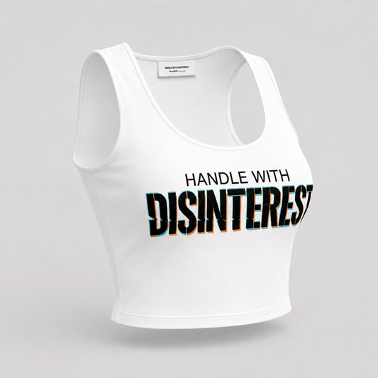 White fitted crop top with bold black HANDLE WITH DISINTEREST print across the chest, angled front view on a plain light background.