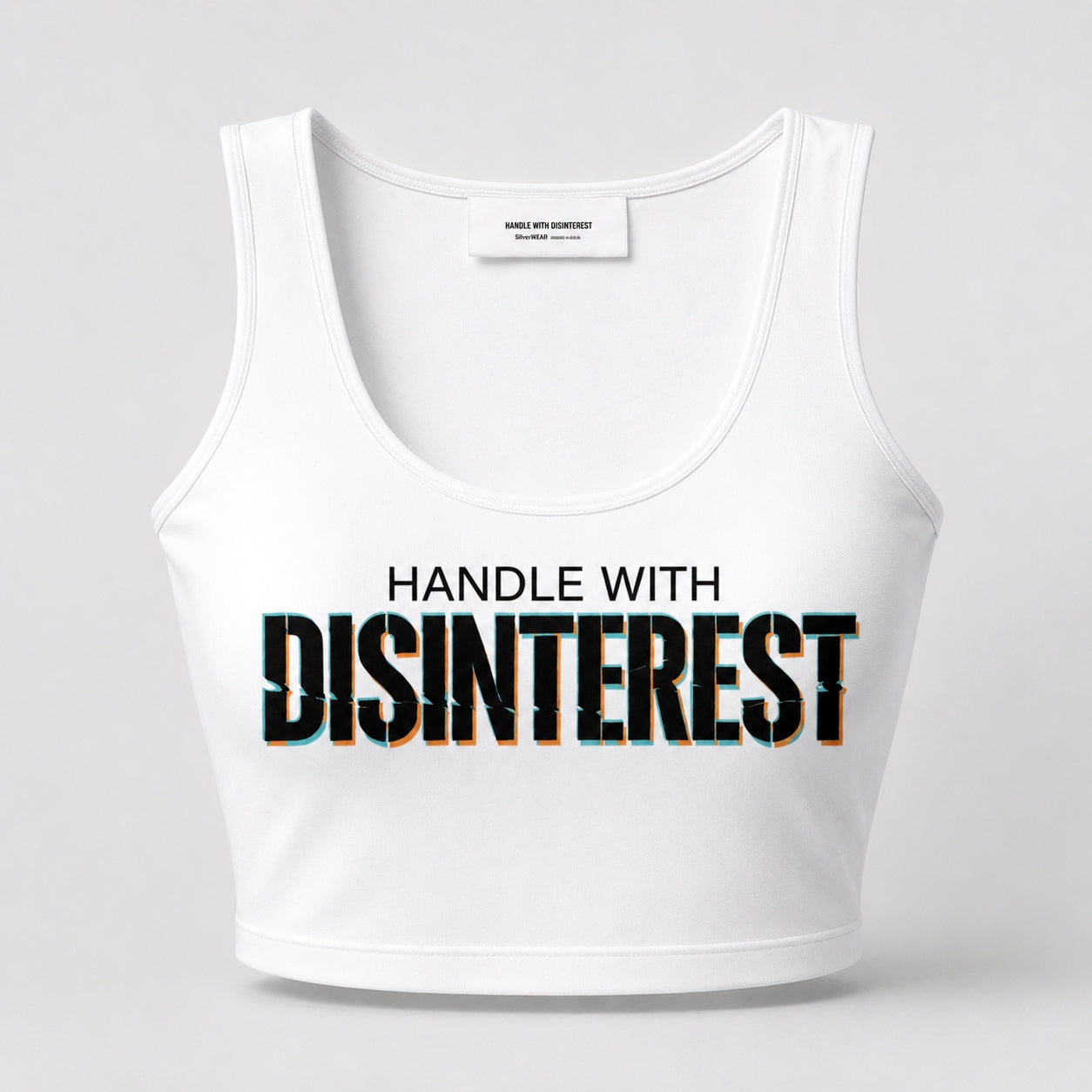 White tank top with 'HANDLE WITH DISINTEREST' text on a light gray background