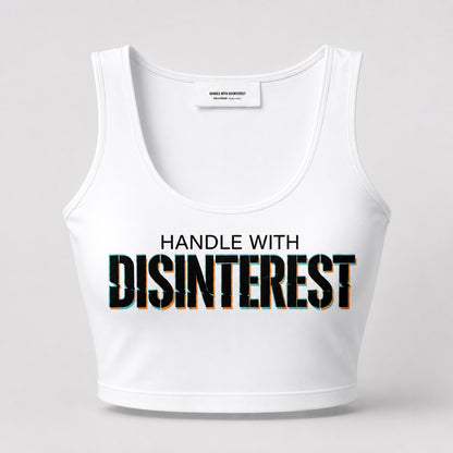 White tank top with 'HANDLE WITH DISINTEREST' text on a light gray background