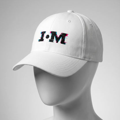White cap with 'I·M' logo on a gray background