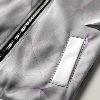 Close-up of a gray jacket with geometric pattern and zipper detail