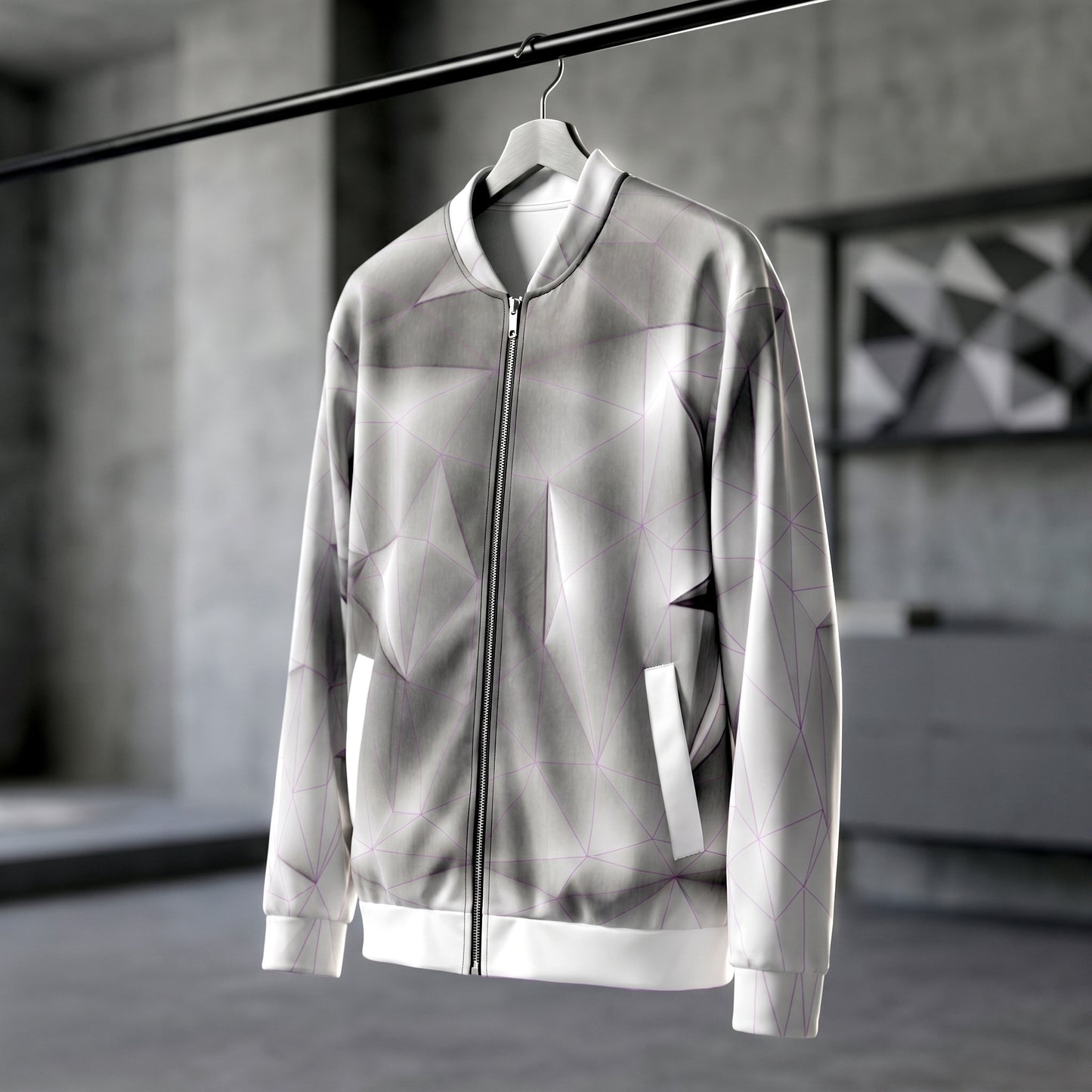 Silver reflective jacket on a hanger against a blurred indoor background