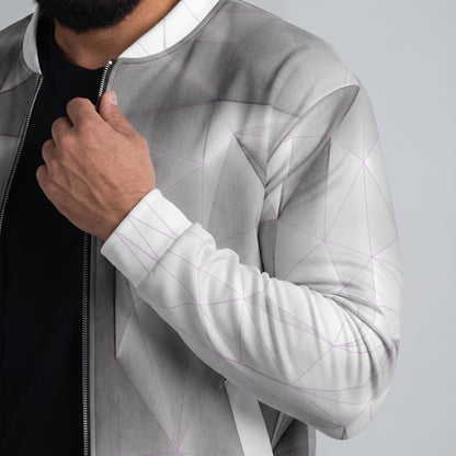 Person wearing a modern, geometric-patterned jacket with a neutral background