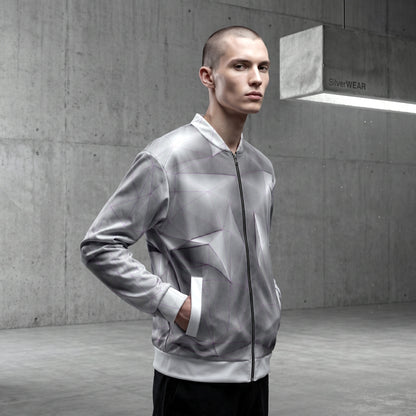 Man wearing a gray and white jacket in an urban setting