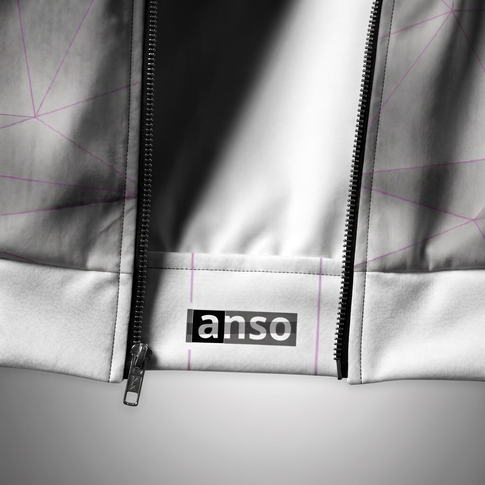 Close-up of a gray jacket with a zipper and 'anso' branding on a light gray background.