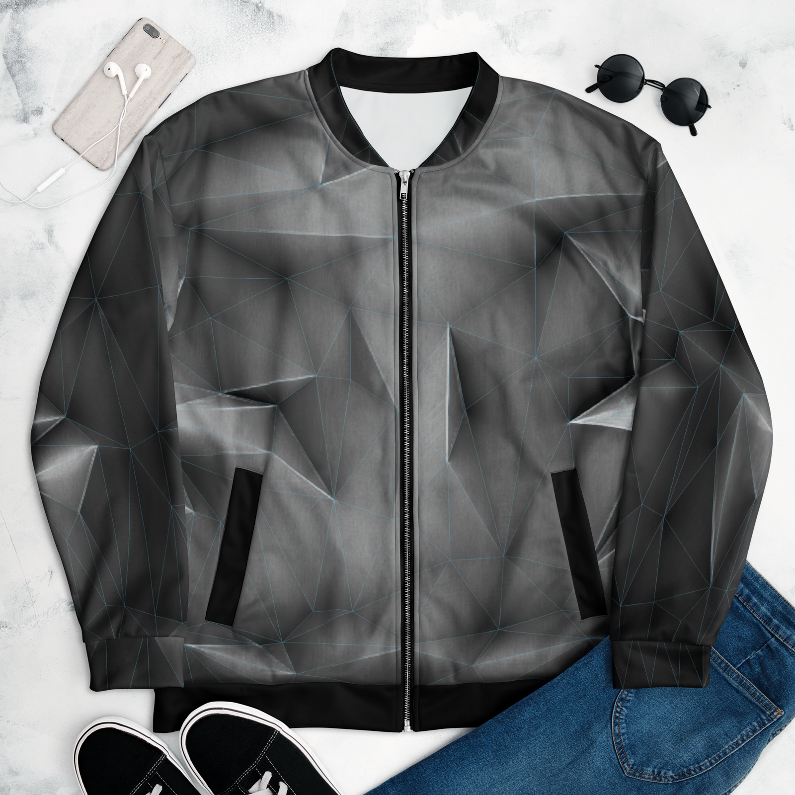 Geometric patterned jacket on a white background with accessories.