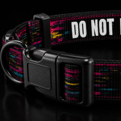 Dog collar with colorful pattern and 'DO NOT' text on a black background