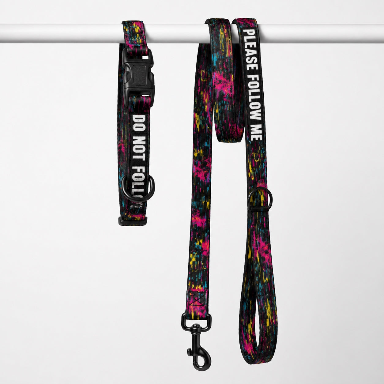 Dog collar and leash set with colorful splatter design and text on a white background