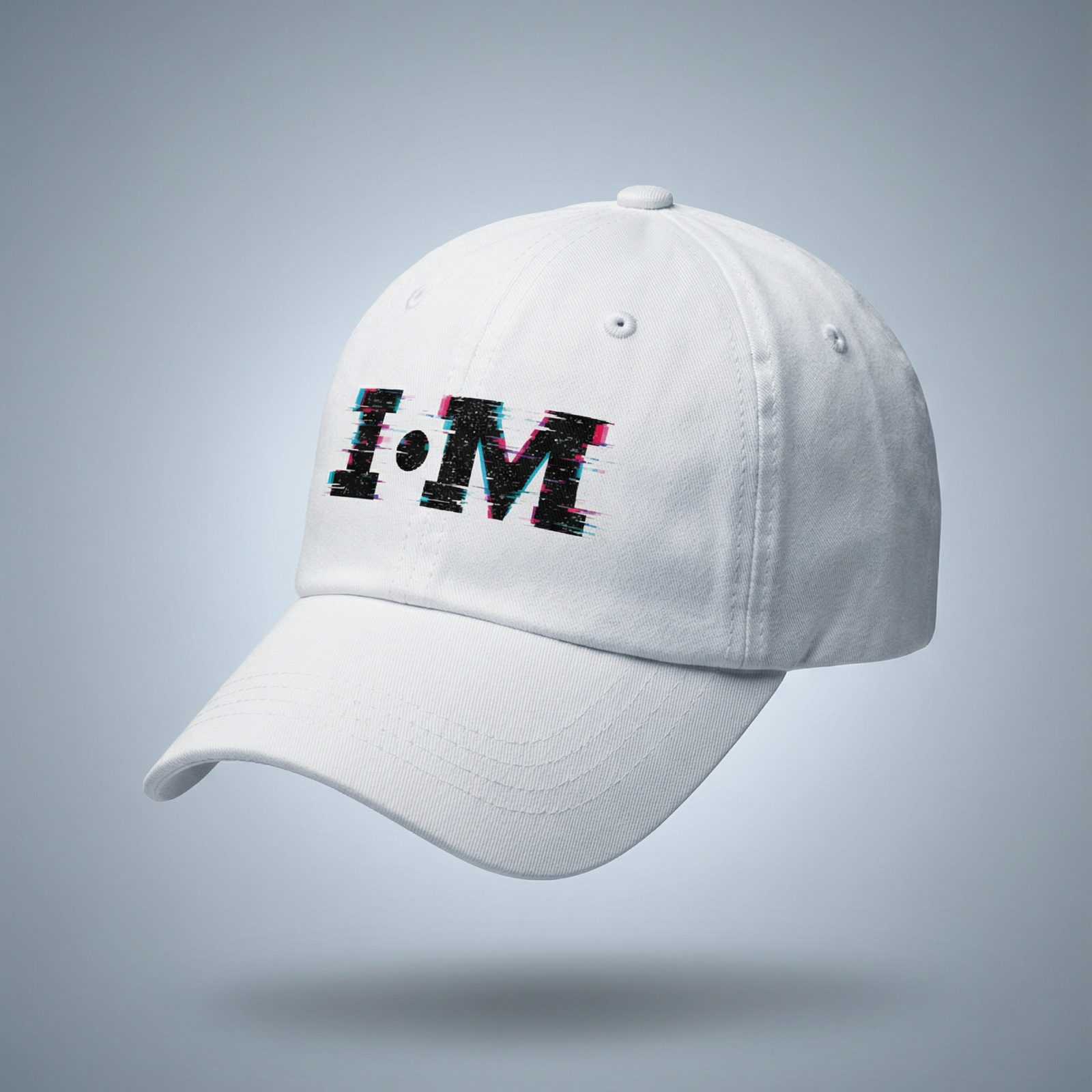 White cap with 'I.M' logo on a gray background