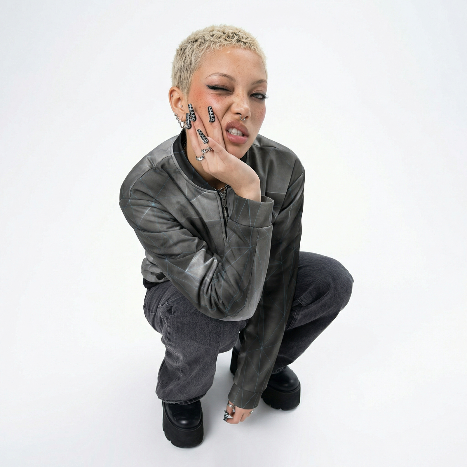 Woman wearingBlue grid 'anso' all-over print bomber jacket on a white background