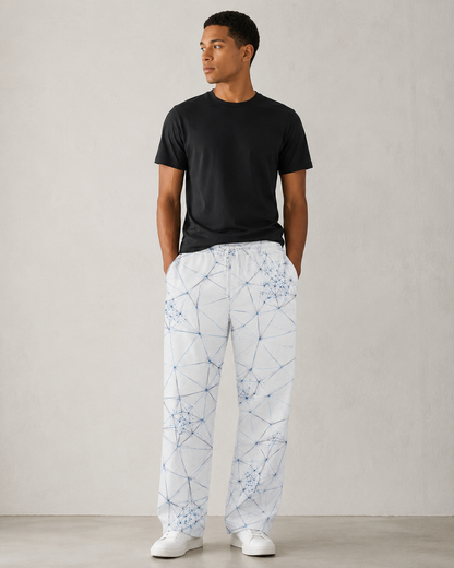 Model wearing ANSO Wire Field wide-leg joggers in a clean design-led interior setting.