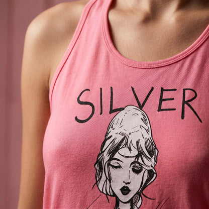 Pink tank top with a graphic of a woman's face and the word 'SILVER' on a pink background