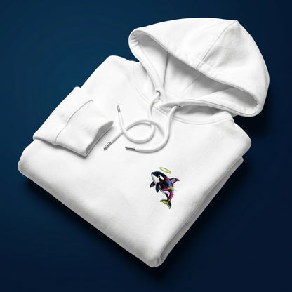 White hoodie with a colorful orca whale design on a dark blue background